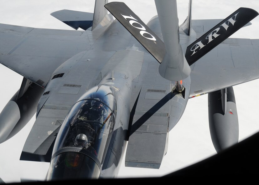 ALANTIC OCEAN – Capt. John Mcfarland, 494th Fighter Squadron weapons system officer, watches as his aircraft, a F-15E Strike Eagle, receives fuel from a 100th Air Refueling Wing KC-135 Stratotanker during an aerial refueling mission Aug. 2, 2012, over the Atlantic Ocean. Mcfarland is the brother of Capt. Michael Mcfarland, 351st Air Refueling Squadron and the KC-135 aircraft commander for this mission. (U.S. Air Force photo/Senior Airman Rachel Waller)