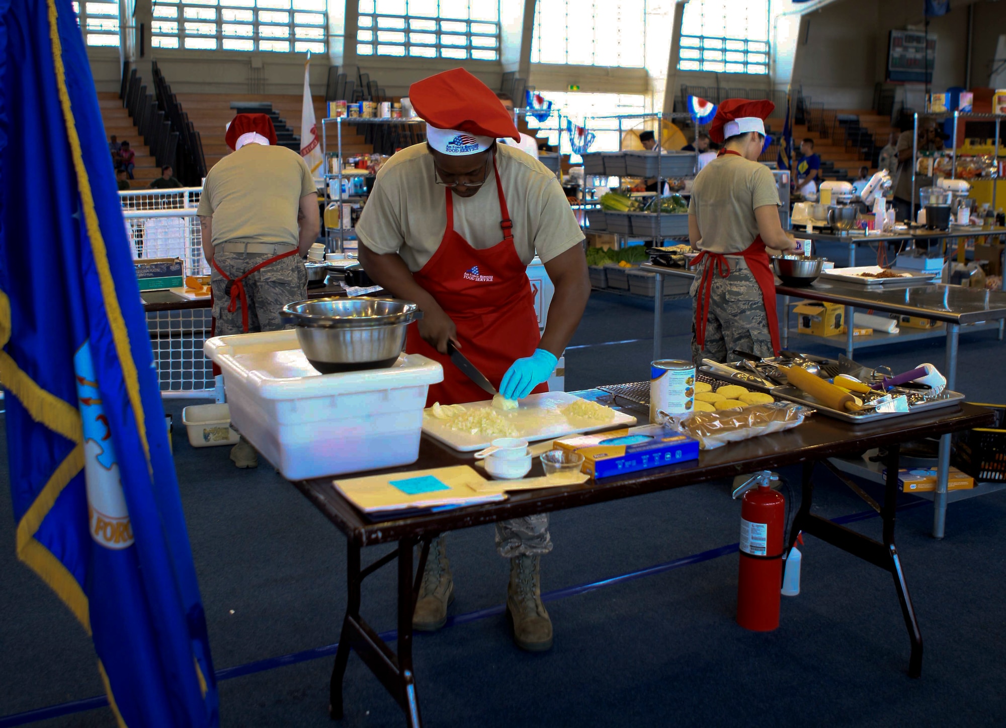 Members of the 18th Force Support Squadron, Kadena Air base, compete in the Okinawa Inter-Service Cook-off on Camp Foster, Japan, July 28, 2012. Teams from each branch including the U.S. Marine Corps and the U.S. Army competed in the event, with the Army taking first place and the Air Force taking second. (U.S. Army photo/Chip Steitz) 