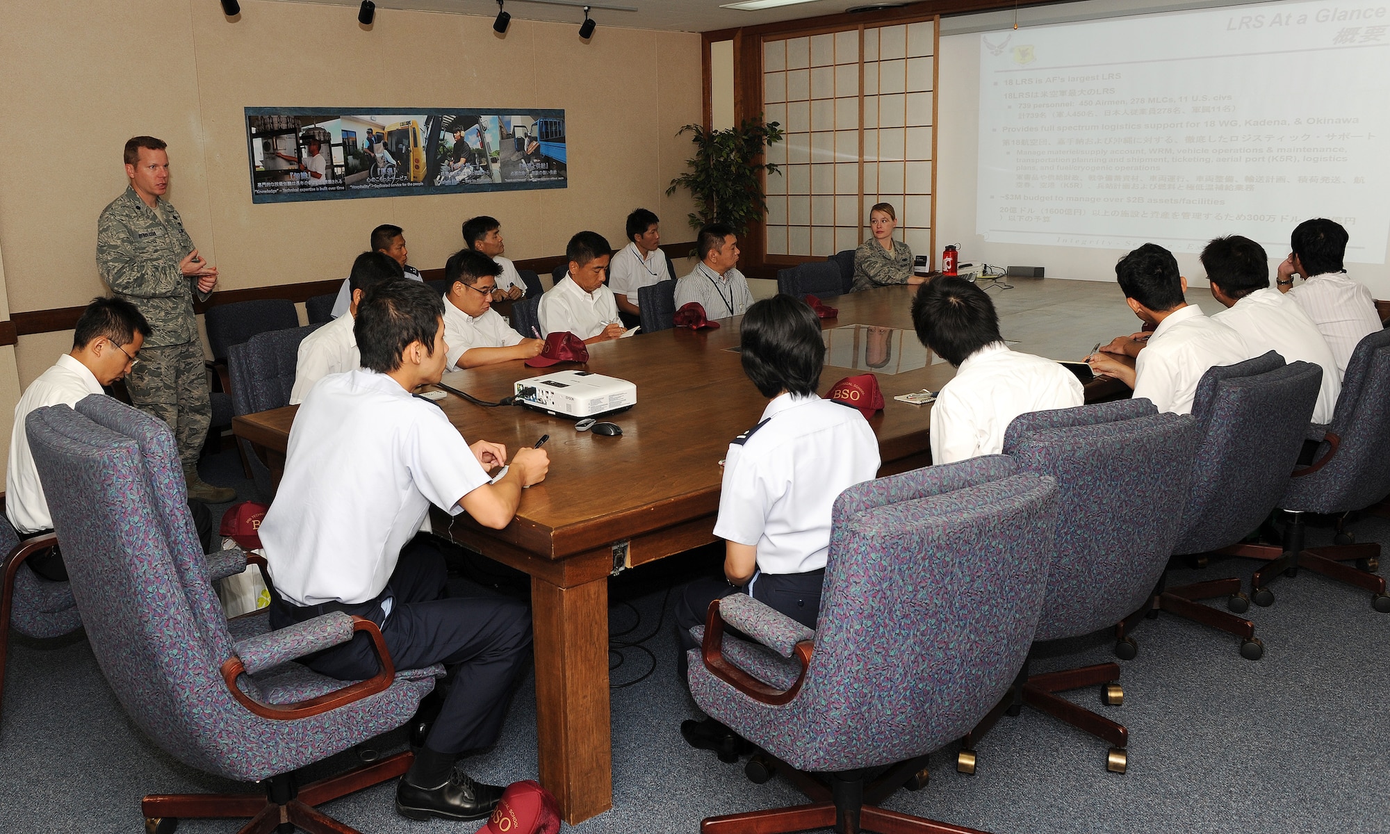 U.S. Air Force Lt. Col. Robert Henderson, 18th Logistics Readiness Squadron commander, briefs Japan Air Self-Defense Force members at Kadena Air Base, Japan, July 25, 2012. The JASDF members had the opportunity to learn about the facility and visit the fuels yard, fuels lab, and pump house. (U.S. Air Force photo/Junko Kinjo)