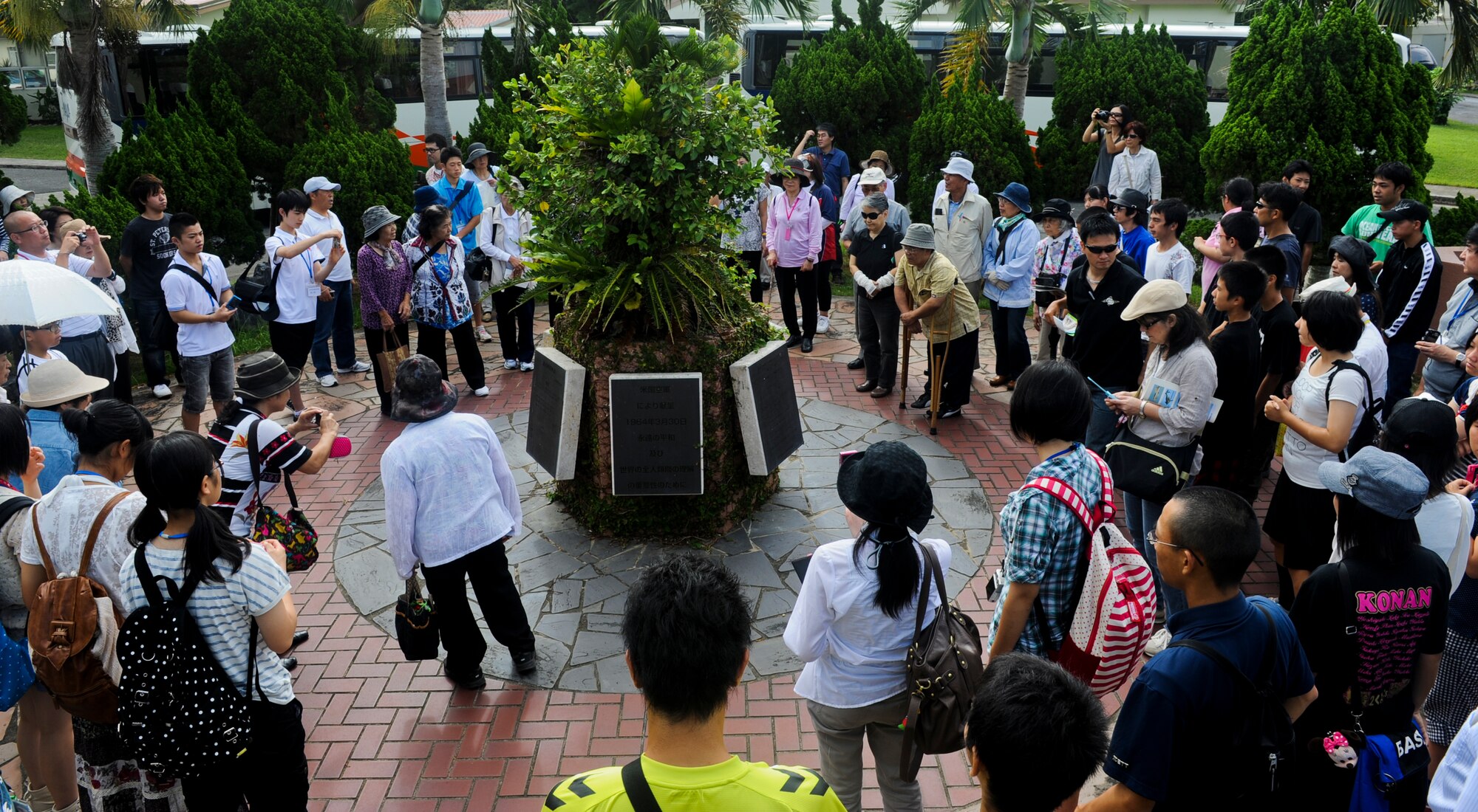 More than 100 Okinawa City natives take pictures during a historic site tour on Kadena Air Base, Japan, July 31, 2012. These members visited various sites on base during Okinawa's Peace Campaign which lasts from Aug. 1 to Sept. 7 each year. (U.S. Air Force photo/Airman 1st Class Justin Veazie)