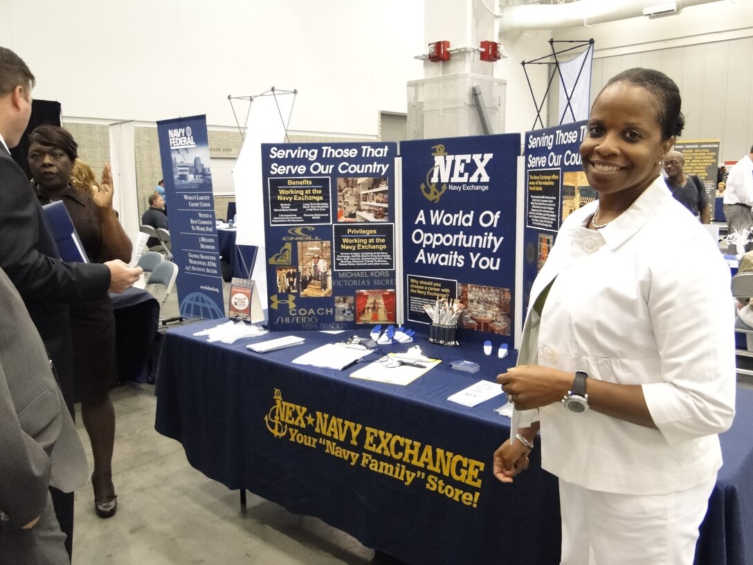 Lockette Dickerson, a Navy Exchange human resources associate and Navy wife, speaks with prospective employees at a job fair in Hampton, Va., Aug. 3, 2012. DOD photo by Lisa Daniel
