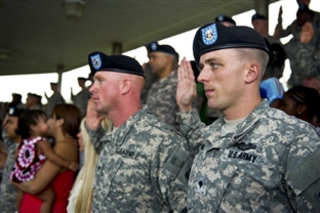 Soldiers re-enlist during a ceremony hosted by Army Chief of Staff Gen. Ray Odierno on Fort Stewart, Ga., Aug. 6, 2012. The soldiers are assigned to the 3rd Infantry Division.