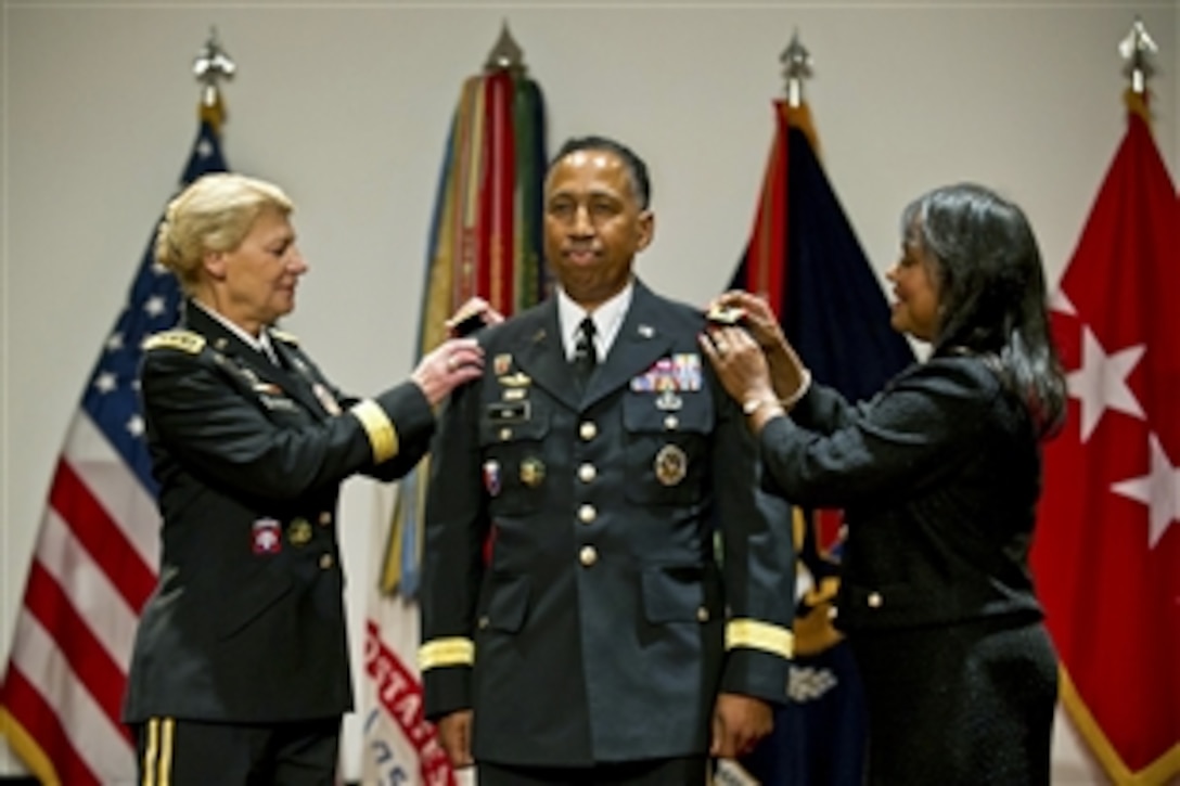 Army Gen. Ann E. Dunwoody, commanding general of Army Materiel Command, promotes Army Lt. Gen. Dennis L. Via to the rank of general during a ceremony at Redstone Arsenal near Huntsville, Ala., Aug. 7, 2012. Via's wife, Linda, right, participated in the ceremony. Via is the first Army Signal Corps officer to achieve that rank.





