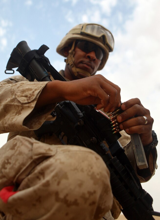 Sgt. Sean Washington, a New York City native, and landing support specialist with Combat Logistics Battalion 24, 24th Marine Expeditionary Unit, loads a magazine of 5.56 ammunition prior to an unknown distance live-fire range at Udairi Range in Kuwait, June 26, 2012. The Marines are in Kuwait as part of a sustainment training package. The 24th MEU is deployed with the Iwo Jima Amphibious Ready Group as a U.S. Central Command theater reserve force providing support for maritime security operations and theater security cooperation efforts in the U.S. 5th Fleet area of responsibility.