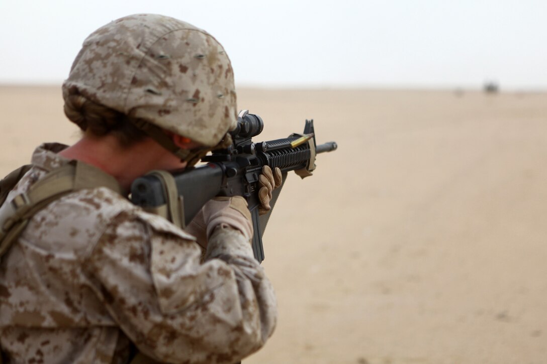 Lance Cpl. Ariel Rose, an Elm Creek, Neb., native, and radio operator with Combat Logistics Battalion 24, 24th Marine Expeditionary Unit, fires her M-16A4 service rifle during an unknown distance live-fire range at Udairi Range in Kuwait, June 26, 2012. The Marines are in Kuwait as part of a sustainment training package. The 24th MEU is deployed with the Iwo Jima Amphibious Ready Group as a U.S. Central Command theater reserve force providing support for maritime security operations and theater security cooperation efforts in the U.S. 5th Fleet area of responsibility.