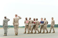 A U.S. Marine Corps carry team transfers the remains of Marine Cpl. Daniel L. Linnabary II, of Hubert, N.C., at Dover Air Force Base, Del., Aug. 8, 2012. Linnabary was assigned to 2nd Tank Battalion, 2nd Marine Division, II Marine Expeditionary Force, Camp Lejeune, N.C. (U.S. Air Force photo/Roland Balik)