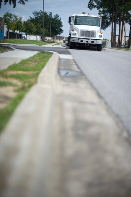 An Airman from the 1st Special Operations Civil Engineering Squadron operates a street sweeper on Tully Street, Hurlburt Field, Fla., Aug. 8, 2012. Street sweeping is effective at removing microscopic pollutants that collect on our streets and parking lots. (U.S. Air Force Photo/Airman 1st Class Hayden K. Hyatt)
