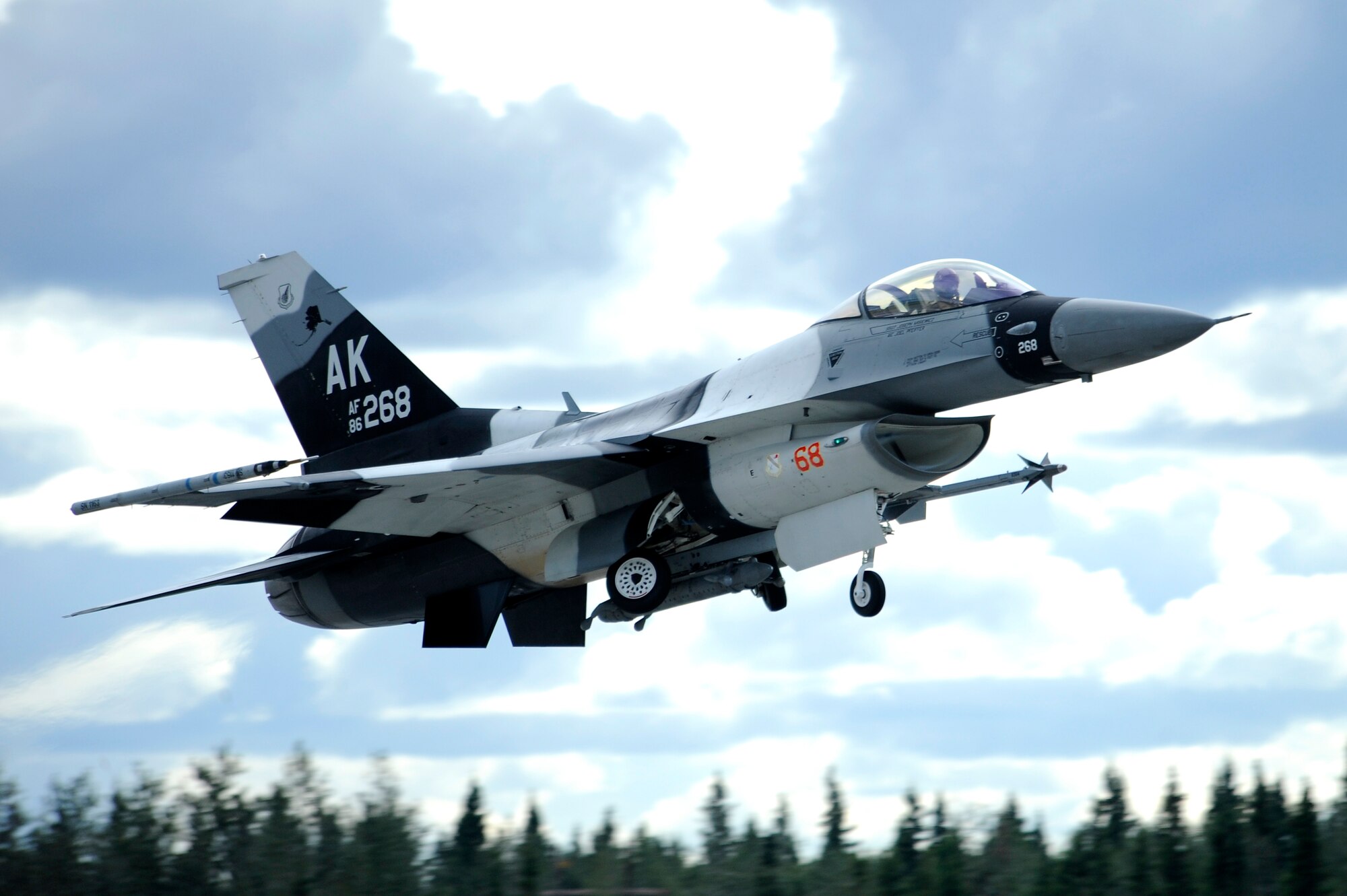An F-16 Fighting Falcon assigned to the 18th Aggressor Squadron takes off during RED FLAG-Alaska 12-3 Aug. 6, 2012, Eielson Air Force Base, Alaska.  Aggressor pilots are trained to act as opposing forces in RF-A to prepare U.S. and allied forces for real-world aerial combat. (U.S. Air Force photo/Staff Sgt. Jim Araos)