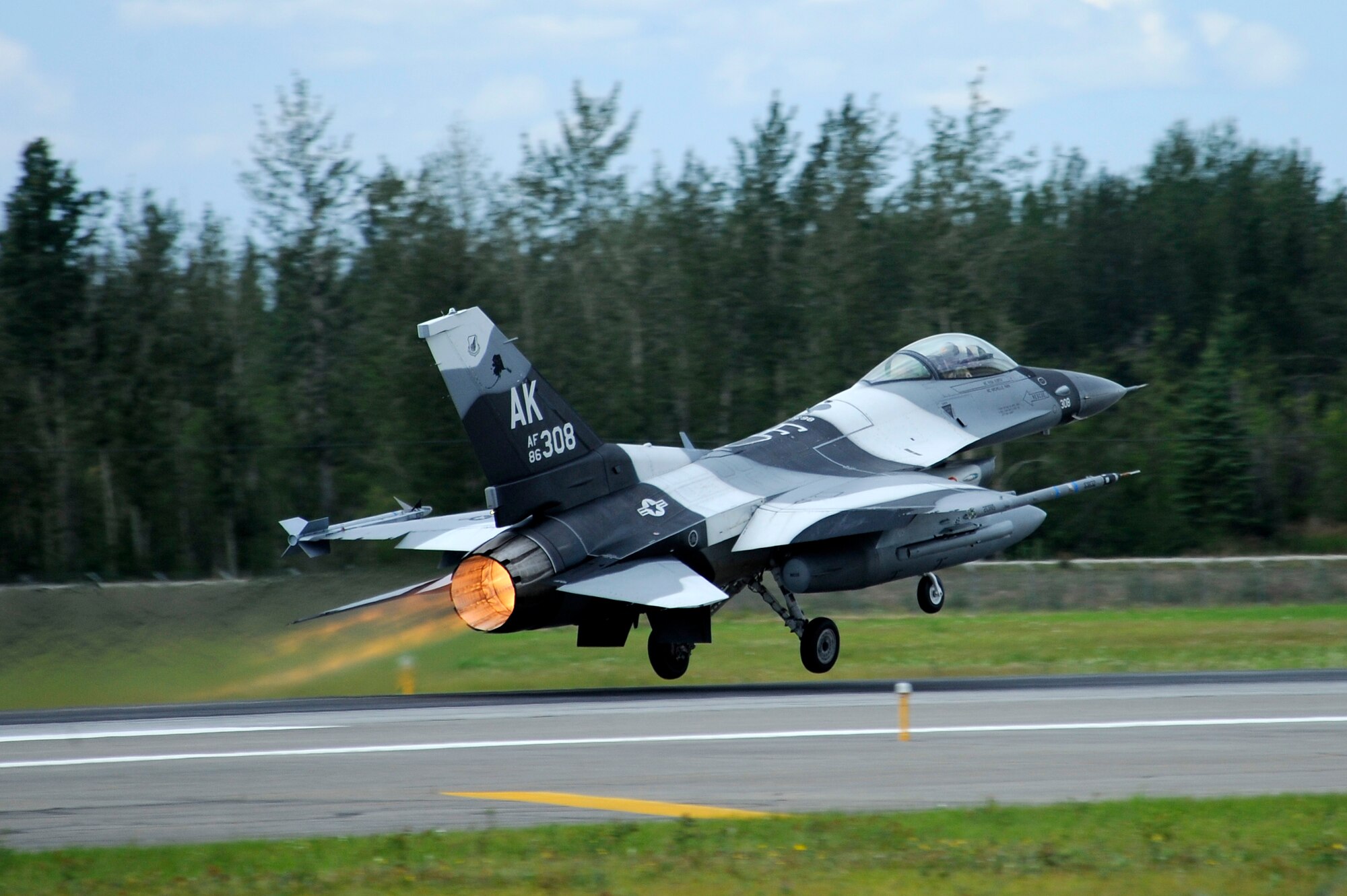 An F-16 Fighting Falcon assigned to the 18th Aggressor Squadron takes off during RED FLAG-Alaska 12-3 Aug. 6, 2012, Eielson Air Force Base, Alaska.  The F-16 is a compact, highly maneuverable fighter aircraft, vastly proven in air-to-air combat and air-to-surface attack. (U.S. Air Force photo/Staff Sgt. Jim Araos)