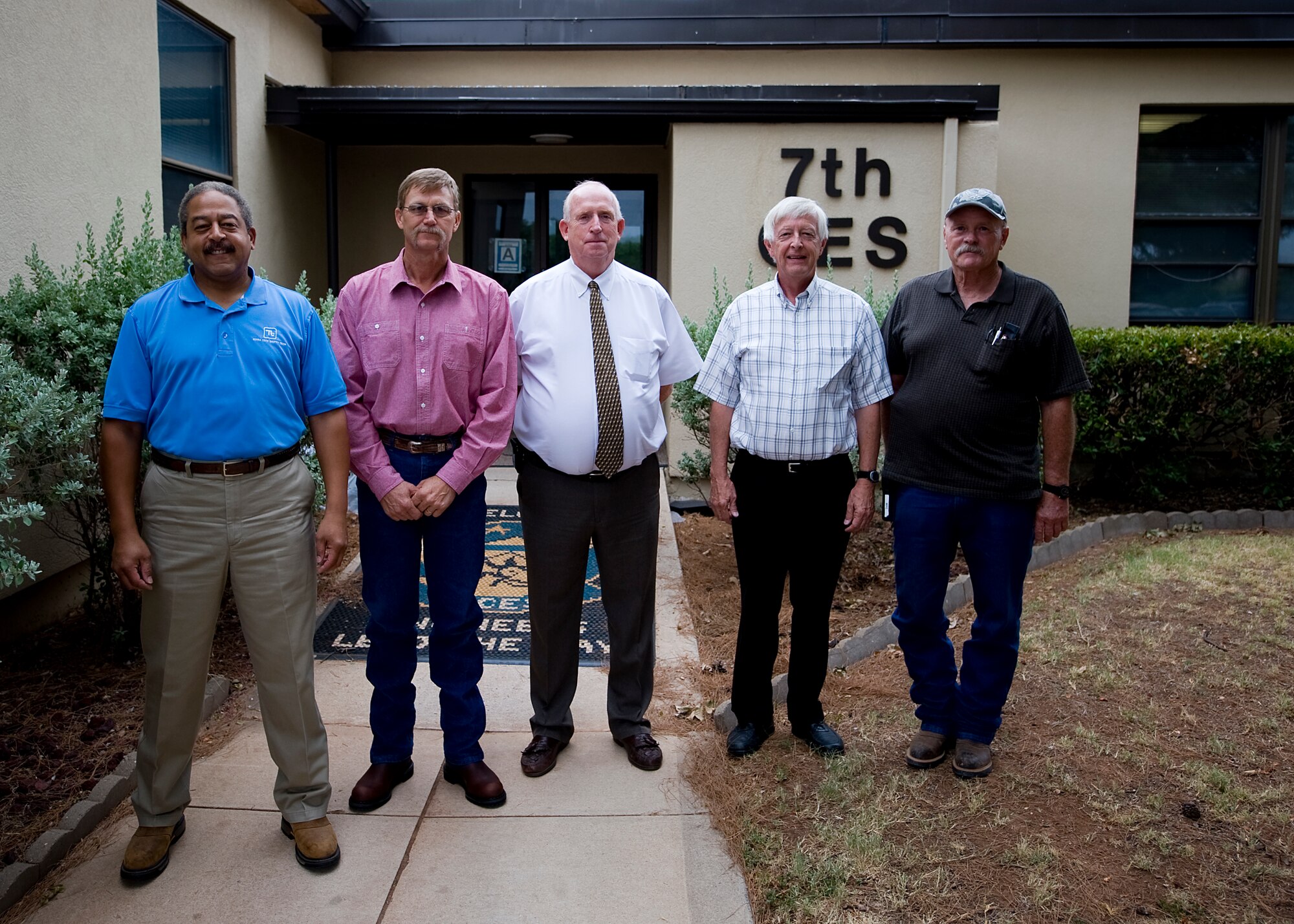 (From left to right) Eric Watson, Brad Butler, Ronald Miller, Tom Denslow and Michael Kinman, members of the Dyess energy team, pose for a photo outside of the 7th Civil Engineer Squadron building, Aug. 8, 2012, at Dyess Air Force Base, Texas. Thanks to the team, Dyess was recently presented a Federal Energy Management Program award by the Department of Energy. The award is presented to individuals and organizations with the federal government that significantly contribute to the efficient use of energy and water resources. (U.S. Air Force photo by Airman 1st Class Damon Kasberg/Released)