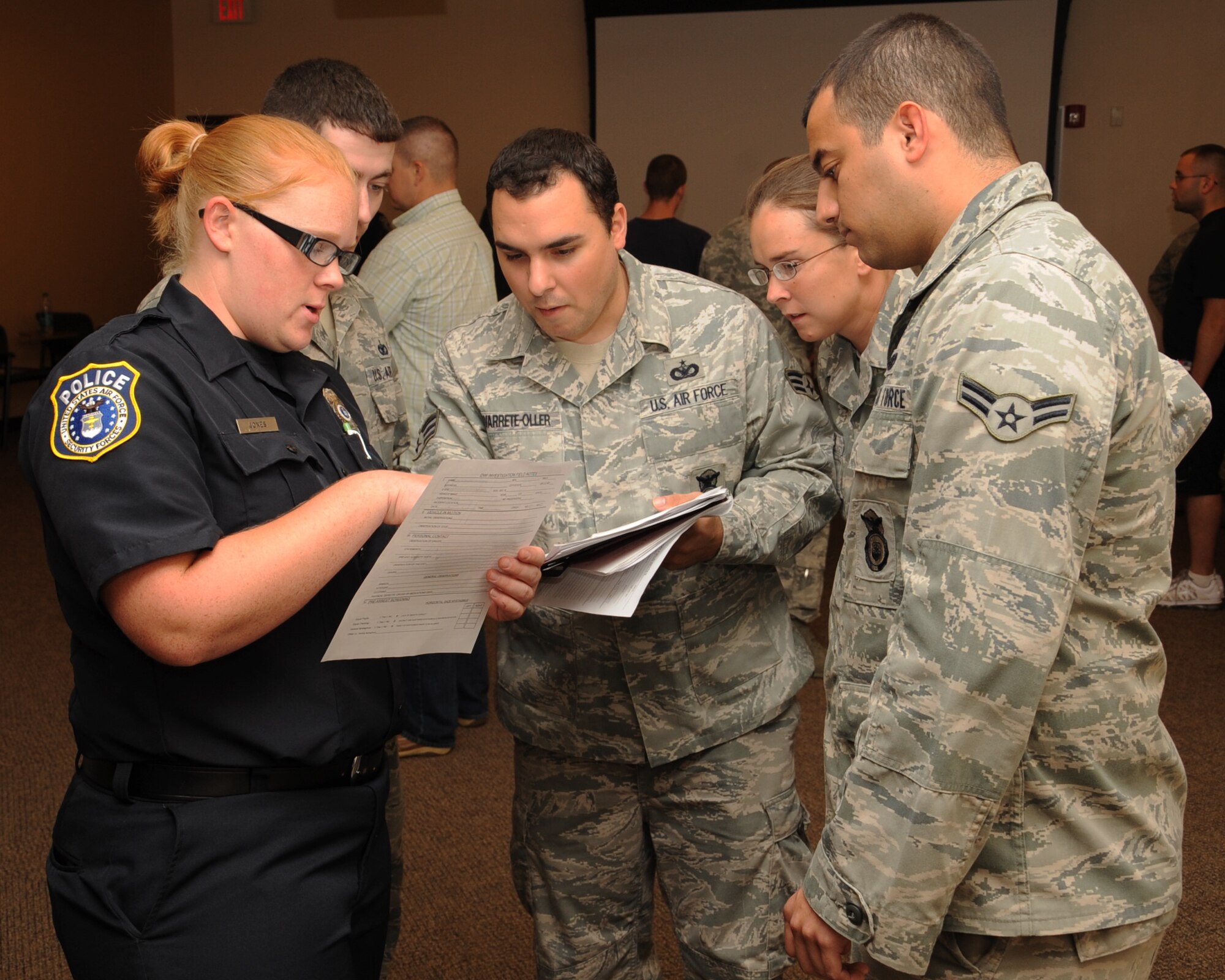 2nd Security Forces Squadron personnel review data collected during a standard field sobriety training course on Barksdale Air Force Base, La., Aug. 7. The three day course included classroom instruction and hands on training, in which field sobriety tests were administered to selected volunteers. (U.S. Air Force photo/ Senior Airman Sean Martin)(RELEASED)