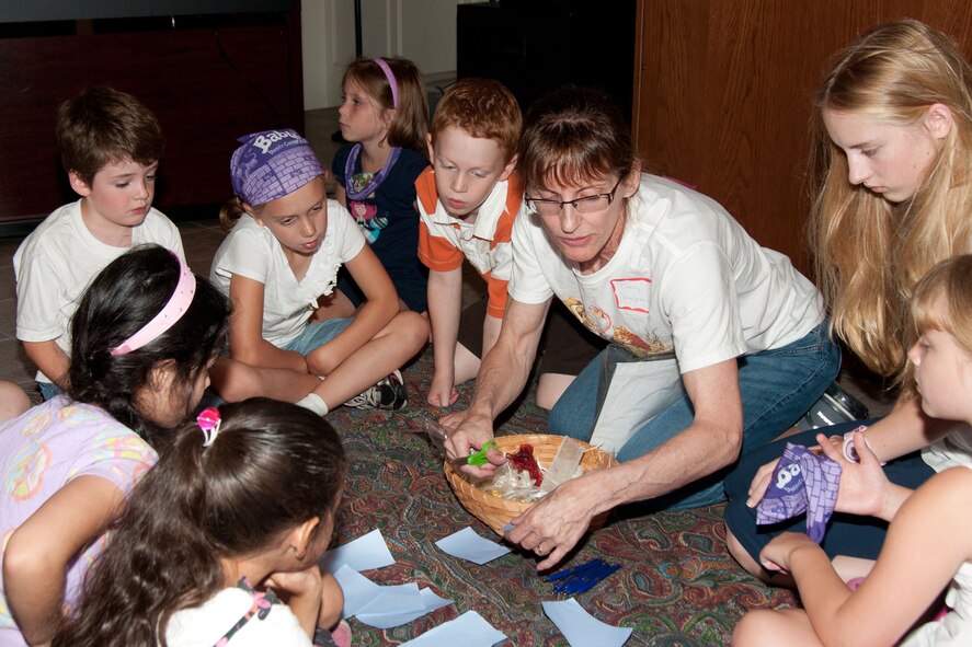 HANSCOM AIR FORCE BASE, Mass. – Parishioner Cheryl Socha leads “Tribe Time” for Tribe Benjamin during a lesson at Vacation Bible School Aug. 6. VBS is a program for kids ages five through fifth grade that integrates Bible lessons with fun activities and takes place for a week each summer. (U.S. Air Force photo by Linda LaBonte Britt) 