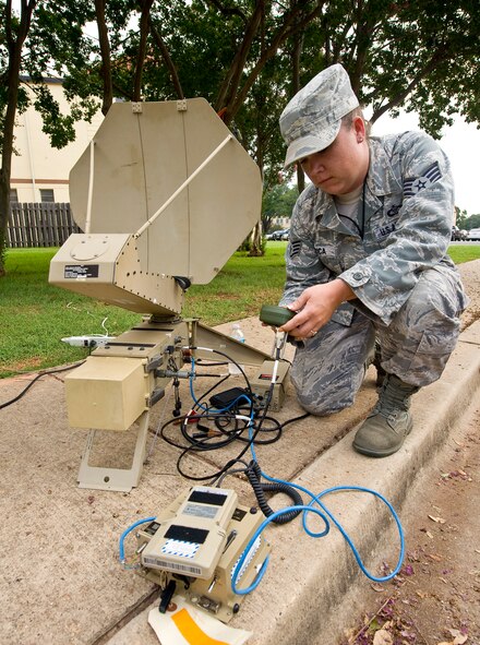 Staff Sgt. Margaret Verica, Air Force Global Strike Command current operations, operates a single channel anti-jam manned portable on Barksdale Air Force Base, La., Aug. 8. Verica is writing the training plan for the SCAMP, which is used by Command Post personnel while deployed. Command Post personnel must be trained on the SCAMP, which links with satellites to receive secure emergency action messages in remote locations. (U.S. Air Force photo/Staff Sgt. Chad Warren)(RELEASED)