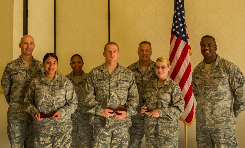 Col. Justin Davey, 628th Mission Support Group commander, and Chief Master Sgt. Avery Jones, 628th Mission Support Group superintendent, pose with the Diamond Sharp Award winners and their first sergeants Aug. 7, 2012, at Joint Base Charleston, S.C. (Front Row) Airman 1st Class Brissely Nunez, 628th Comptroller Squadron finance technician, Staff Sgt. Donald McKeown, 628th Air Base Wing Command Post senior emergency actions controller, and Airman 1st Class Nicole Crummy, 628th Logistics Readiness Squadron vehicle maintenance and analysis technician. (Back row) Master Sgt. Nicole Bishop, 628th Comptroller Squadron first sergeant, and Senior Master Sgt. Jeffrey Tynan, 628th Logistics Readiness Squadron first sergeant. The Diamond Sharp award recognizes Airmen whose outstanding performance stands out to their first sergeant. (U.S. Air Force photo by Airman 1st Class George Goslin)