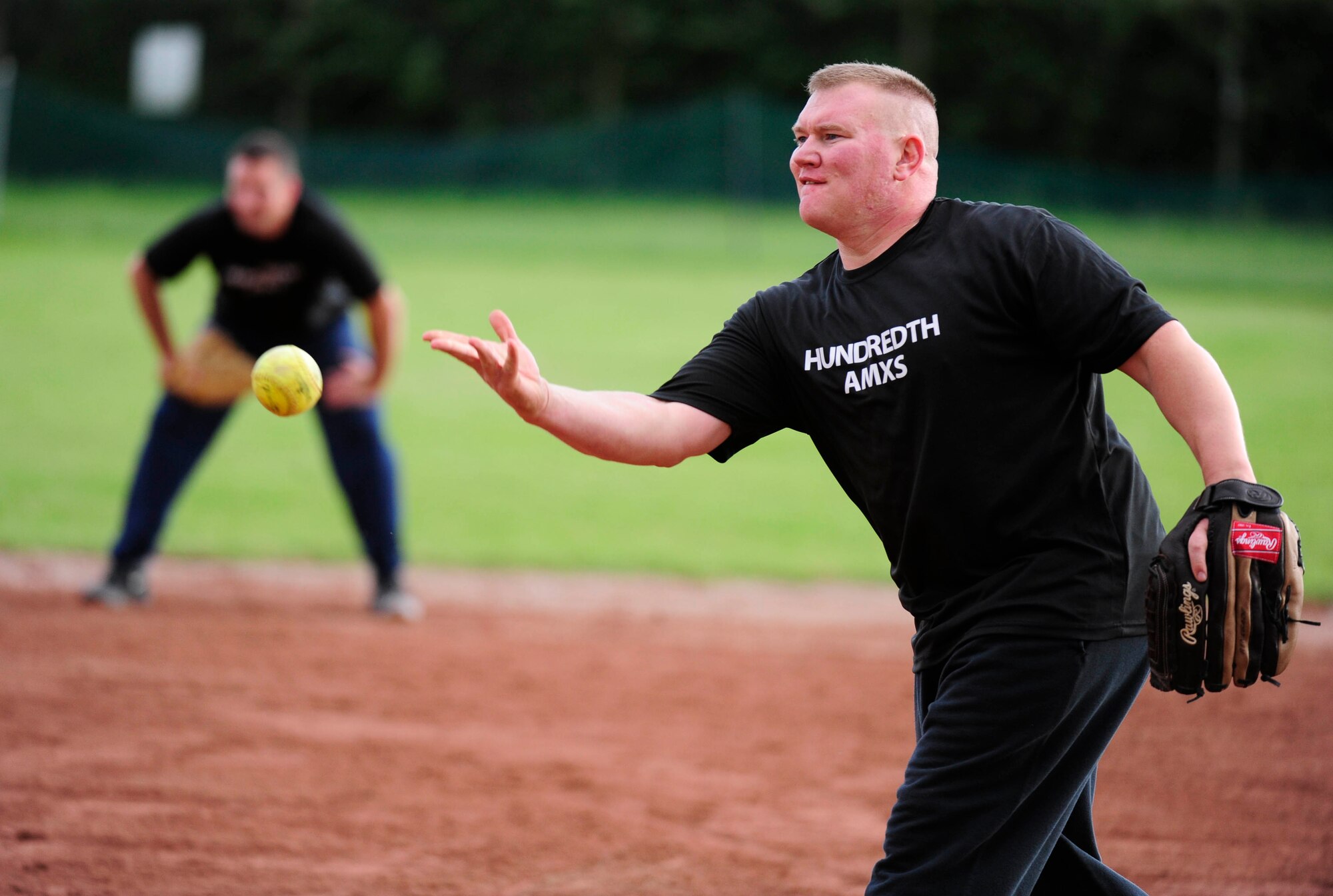 RAF MILDENHALL, England – Austin "Tank" Meyer, 100th Aircraft Maintenance Squadron, pitches against an Airman from the 100th Mission Support Group during an intramural softball game at RAF Mildenhall Aug. 7, 2012. The intramural softball league began May 9 and is composed of 12 teams from various squadrons and groups on base. (U.S. Air Force photo/Senior Airman Ethan Morgan)