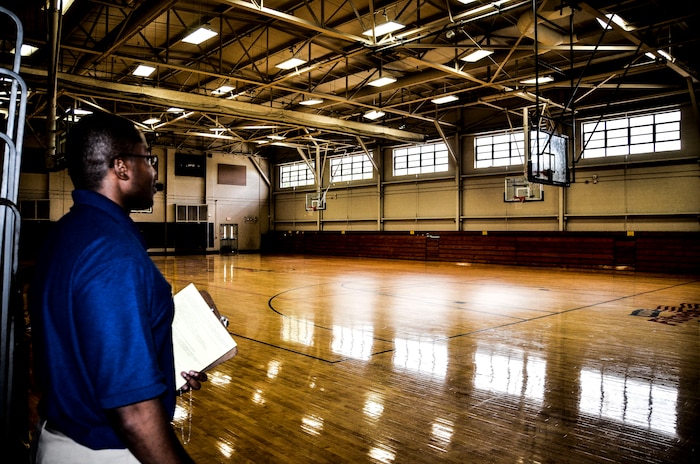 Tech. Sgt. Kayon Dickens, 628th Force Support Squadron Fitness Assessment Cell program manager, takes accountability of personnel in a basketball court Aug. 6, 2012, at the Joint Base Charleston – Air Base Fitness and Sports Center, S.C. The Fitness and Sports Center services more than 1,000 customers daily. (U.S. Air Force photo by Senior Airman Anthony Hyatt)