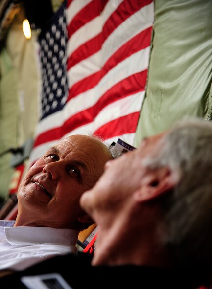 Carl S. Cleveland III and Jim Anderson, chiropractors out of Kansas City, sit aboard a KC-135 Stratotanker above Whiteman Air Force Base, Mo., during the 442nd Fighter Wing Employer Day tour Aug. 4. The 434th Air Refueling Wing aircraft, out of Grissom Air Reserve Base, Ind., came to not only give the civilians a first-hand look at what they do, but also as training - conducting air-to-air refueling with multiple A-10 Thunderbolt II. (U.S. Air Force photo/ Senior Airman Cody H. Ramirez)