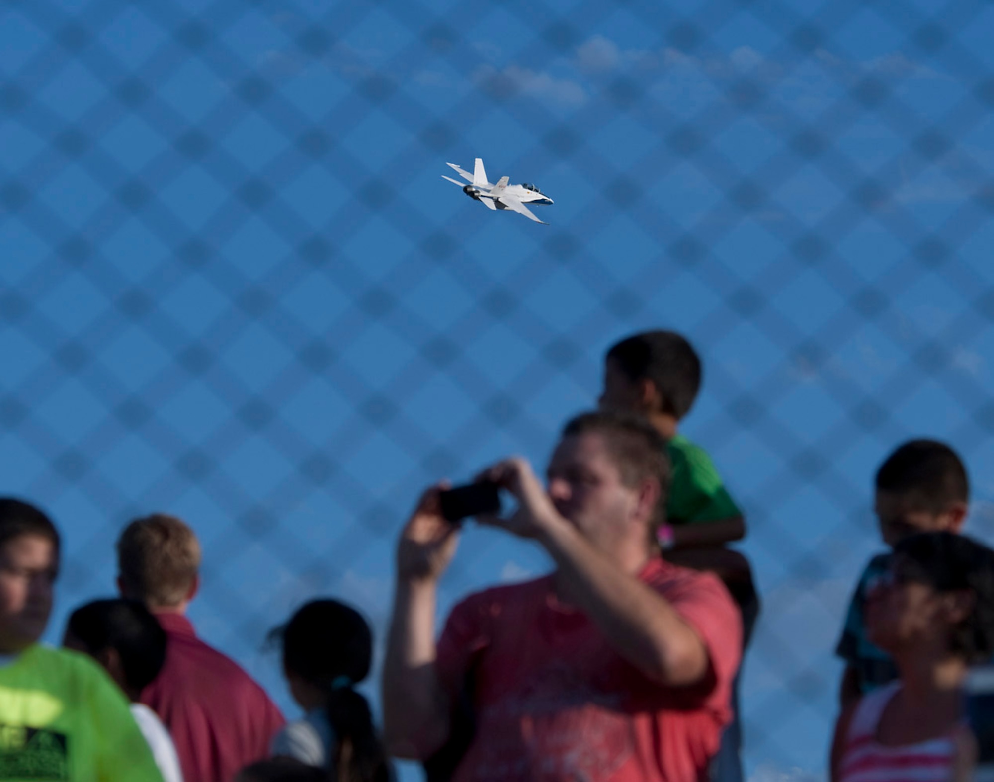 NASA Dryden Flight Research Center provided the F-18 Hornet flyover for Aerospace Appreciation Night at JetHawk Stadium Aug. 4. The aircraft was flown by Troy Asher, NASA DFRC research test pilot, with Tom Jones, NASA DFRC supersonics project manager and flight test engineer, also onboard the aircraft. (NASA Photo by Tom Tschida)