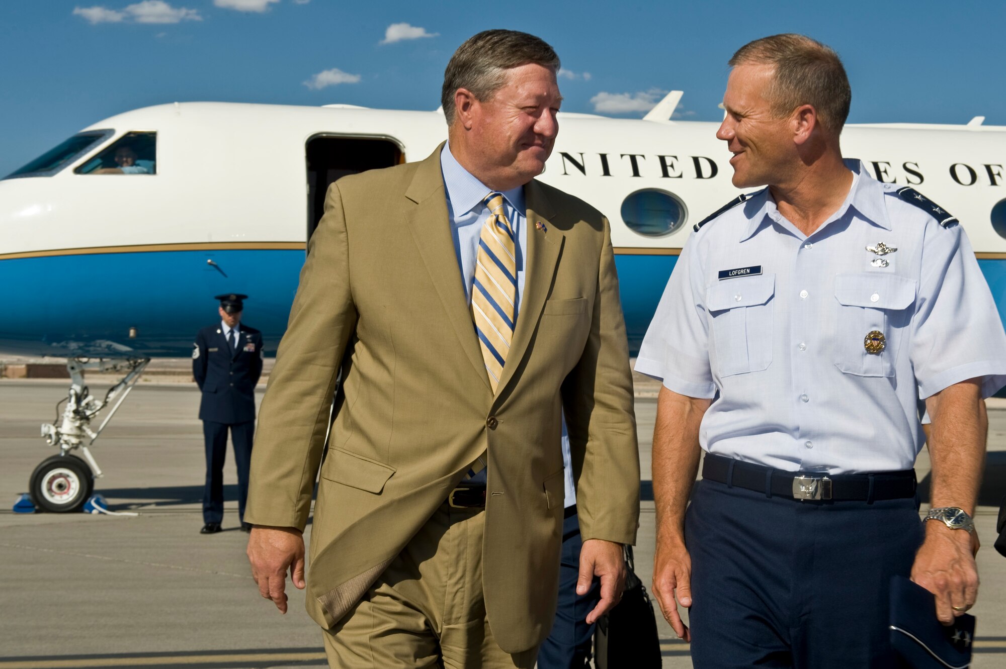 Secretary of the Air Force Michael Donley is greeted by Maj. Gen. Jeffrey G.Lofgren, U.S. Air Force  Warfare Center commander, after landing Aug. 6,2012, at Nellis Air Force Base, Nev.  During a visit to the Las Vegas area, Donley toured Creech Air Force Base, where he hosted an Airmen's Call, and had breakfast with Airmen at Nellis Air Force Base. He was also a keynote
speaker at the 2012 National Clean Energy Summit held in Las Vegas Aug. 7. (U.S. Air Force photo/Airman 1st Class Daniel Hughes)

