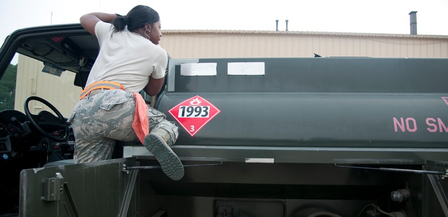 U.S. Air Force Airman 1st Class Clarissa Fields, 23d Logistics Readiness Squadron petroleum, oils and lubricants, fuels a truck during a routine check at Moody Air Force Base, Ga., Aug. 7, 2012. POL is responsible for providing clean, dry fuel to aircraft assigned to Moody. (U.S. Air Force photo by Airman 1st Class Paul Francis/Released)
