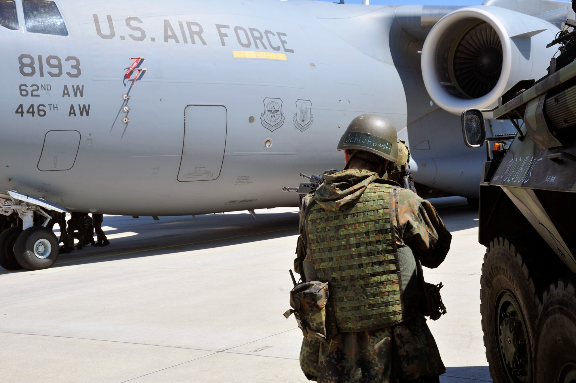 Members of the German air force prepare to enter a C-17 Globemaster III to practice various security techniques Aug. 1, 2011, Ramstein Air Base, Germany. These techniques include hostage recovery, nuclear surety and other methods ensuring preparation in case of an attack on an aircraft. (U.S Air Force photo/Airman 1st Class Trevor Rhynes)