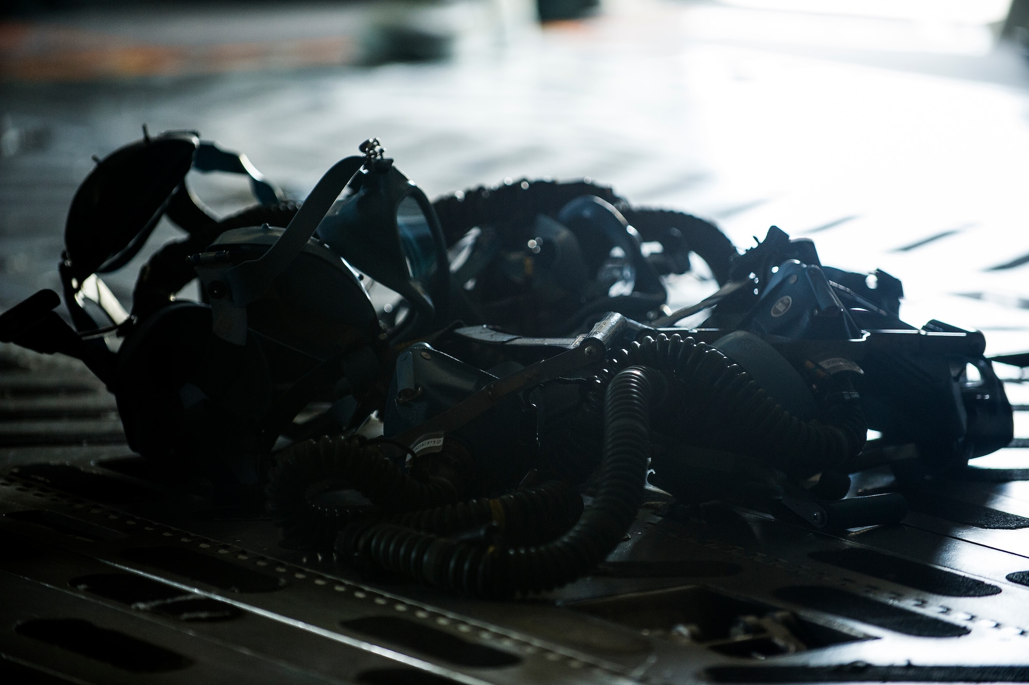 Expired Quick Don Masks sit on the floor of a C-17 Globemaster III during a post-flight equipment swap-out Aug. 6, 2012, at Joint Base Charleston - Air Base, S.C. Members of AFE are essential to aircrews by making sure all flight equipment is in working order including emergency safety equipment, such as parachutes and survival equipment. (U.S. Air Force photo by Airman 1st Class George Goslin)