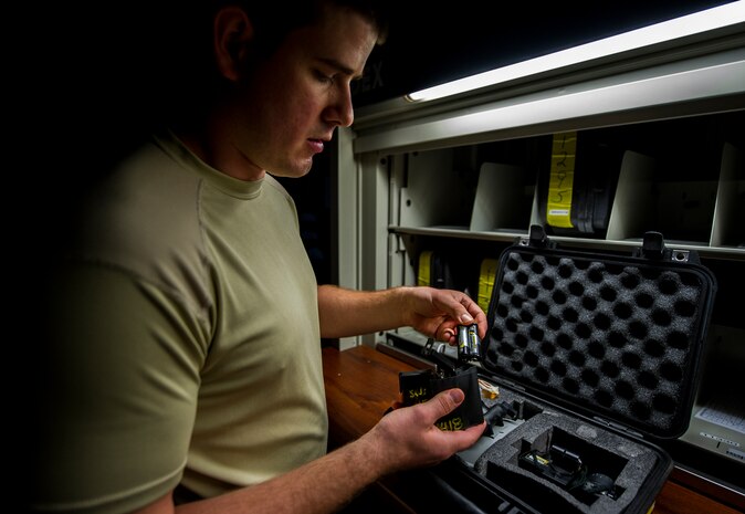 Senior Airman Daniel Godfrey, 437th Operations Support Squadron aircrew flight equipment technician, performs a post flight inspection on a pair of night-vision goggles Aug. 6, 2012, at Joint Base Charleston - Air Base, S.C. Members of AFE are essential to aircrews by making sure all flight equipment is in working order, including emergency safety equipment such as parachutes and survival equipment. (U.S. Air Force photo by Airman 1st Class George Goslin)