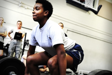 Airman 1st Class Jasmoney Jackson, 1st Combat Camera Squadron photographer, performs a dead lift during a weightlifting test Aug. 3, 2012, at the fitness center at Joint Base Charleston - Air Base, S.C.  The weightlifting test included bench press, squats, dead lifts and pull-ups. The total amount each Airman lifted was divided by their body weight to give a pound-for-pound strength score in both the male and female categories.  The voluntary program was the first weight lifting test held by the 1st CTCS.  It was started by the unit’s fitness monitors to motivate Airmen to diversify their workouts and show them the importance of incorporating strength training.  (U.S. Air Force photo/ Staff Sgt. Nicole Mickle)