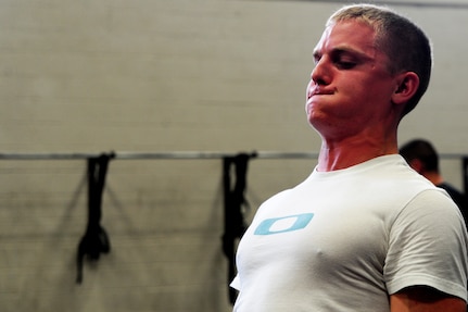 Airman Daniel Johnston, 1st Combat Camera Squadron broadcaster, performs a dead lift press during a weightlifting test Aug. 3, 2012, at the fitness center at Joint Base Charleston - Air Base, S.C.  The weightlifting test included bench press, squats, dead lifts and pull-ups. The total amount each Airman lifted was divided by their body weight to give a pound-for-pound strength score in both the male and female categories.  The voluntary program was the first weight lifting test held by the 1st CTCS.  It was started by the unit’s fitness monitors to motivate Airmen to diversify their workouts and show them the importance of incorporating strength training.  (U.S. Air Force photo/ Staff Sgt. Nicole Mickle)