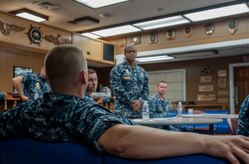 Aviation Ordnanceman Chief Petty Officer David Matlack, Naval Consolidated Brig Charleston, provides feedback to Interior Communications Electrician chief select Christopher Cawthon, NAVCONBRIG, during the Chief Petty Officer Indoctrination Course Aug. 6, 2012, at Joint Base Charleston - Weapons Station, S.C. The CPOIC is designed to prepare newly selected CPOs for their transition from petty officer 1st class to CPO. (U.S. Air Force photo/Airman 1st Class Ashlee Galloway) 

