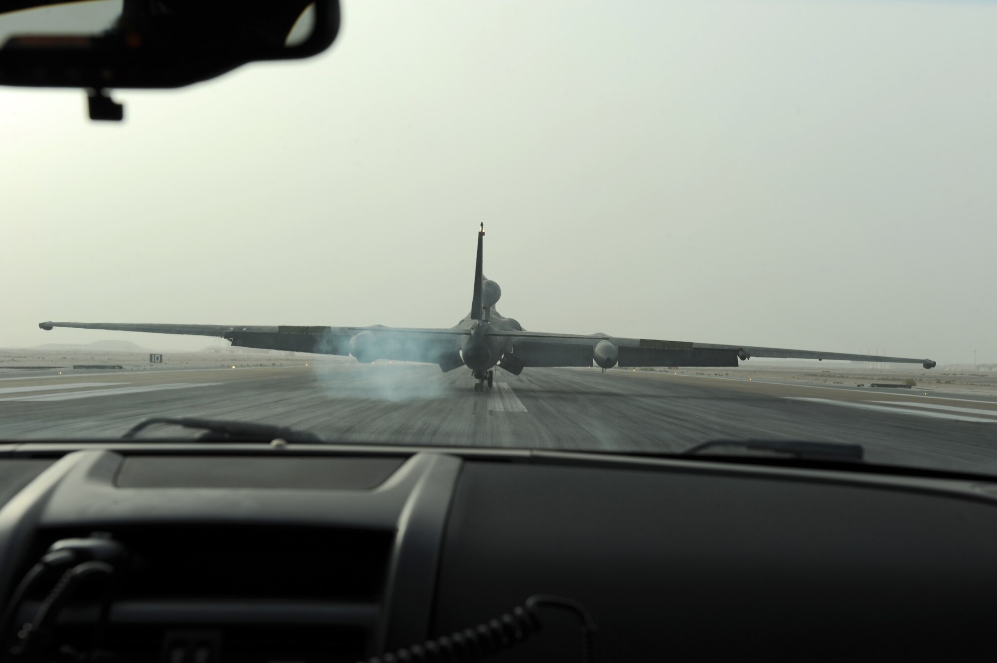 SOUTHWEST ASIA - A U-2S Dragon Lady piloted by Lt. Col. Andrew McVicker, 99th Expeditionary Reconnaissance Squadron commander, burns rubber during landing at the 380th Air Expeditionary Wing Aug. 7, 2012. McVicker, deployed from the 9th Reconnaissance Wing at Beale Air Force Base, Calif., went over the 1,000 flying-hour mark. (U.S. Air Force photo/Master Sgt. Scott MacKay)