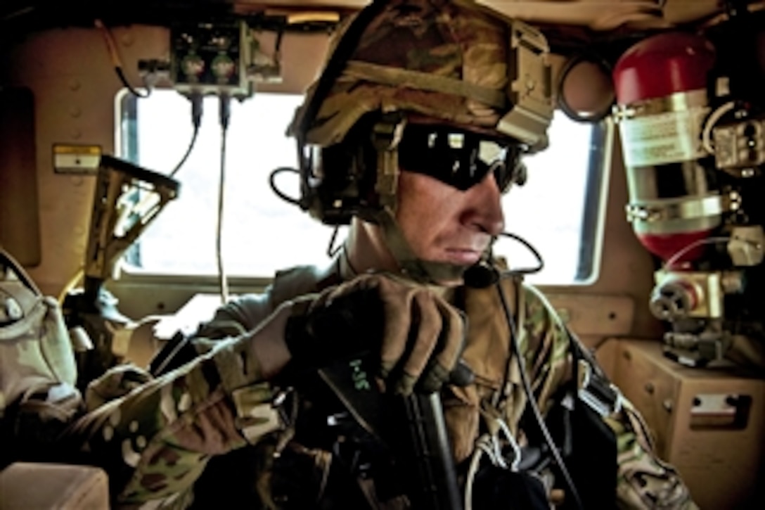 U.S. Air Force Tech. Sgt. Richard Love rides in an armored truck between project sites in Afghanistan's Kapisa province, Aug. 2, 2012. Love, a engineer, is assigned to Provincial Reconstruction Team Kapisa, a unit deployed that coordinates development projects across the province.