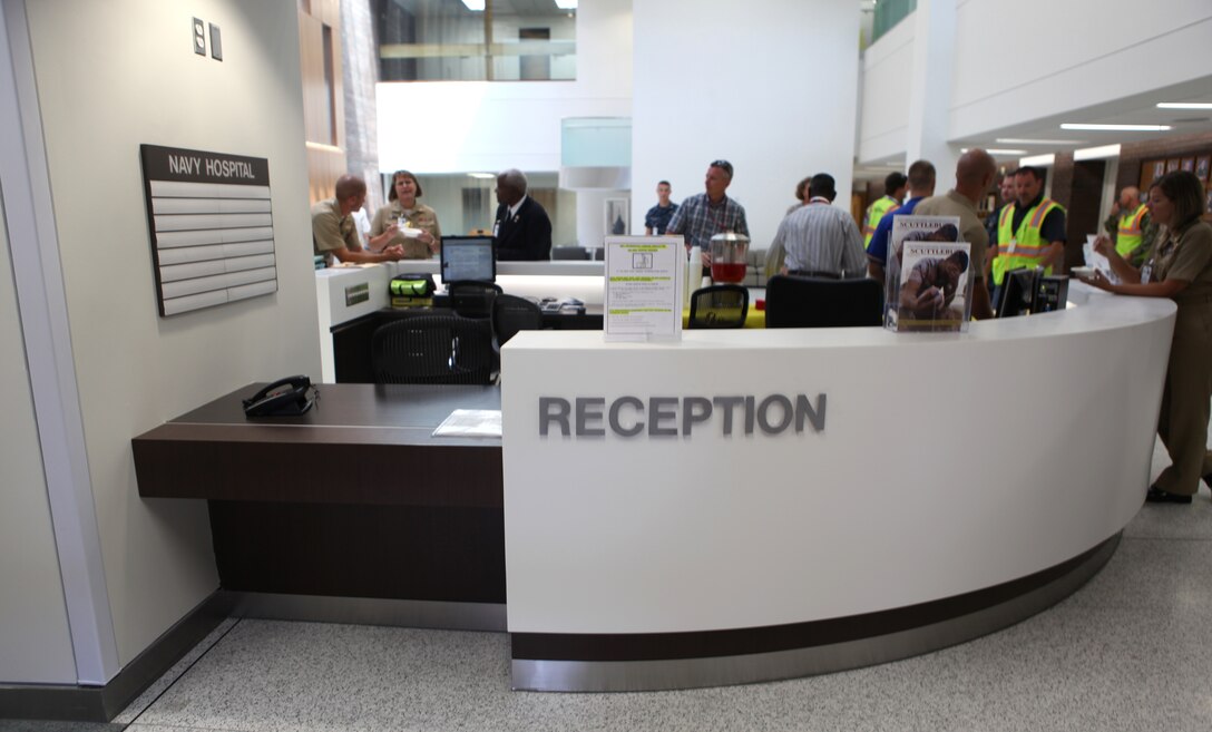 The reception desk of Naval Hospital Camp Lejeune gets used for the first time since renovations began at NHCL’s quarterdeck and lobby aboard Marine Corps Base Camp Lejeune Aug. 8. Pediatrics temporarily shared the reception area was while the construction took place. 