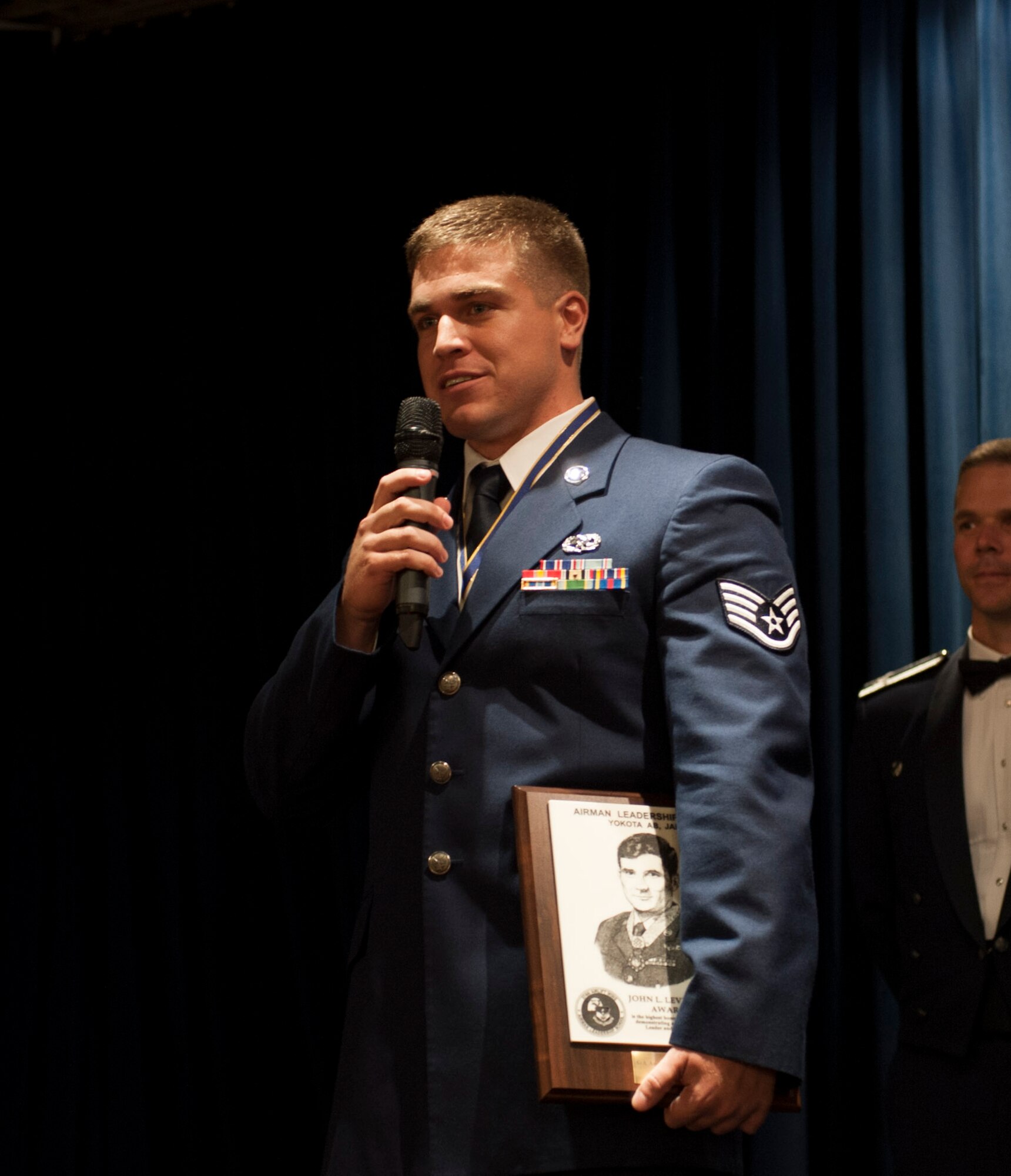 YOKOTA AIR BASE, Japan -- Staff Sgt. Andrew Dittman, 374th Aircraft Maintenance Squadron, gives a speech after receiving the John L. Levitow Award during the Airman Leadership School Class 12-F graduation ceremony at Yokota Air Base, Japan, Aug. 9, 2011. The Levitow Award is the highest honor awarded during Air Force Professional Military Education. (U.S. Air Force photo by Senior Airman Andrea Salazar)