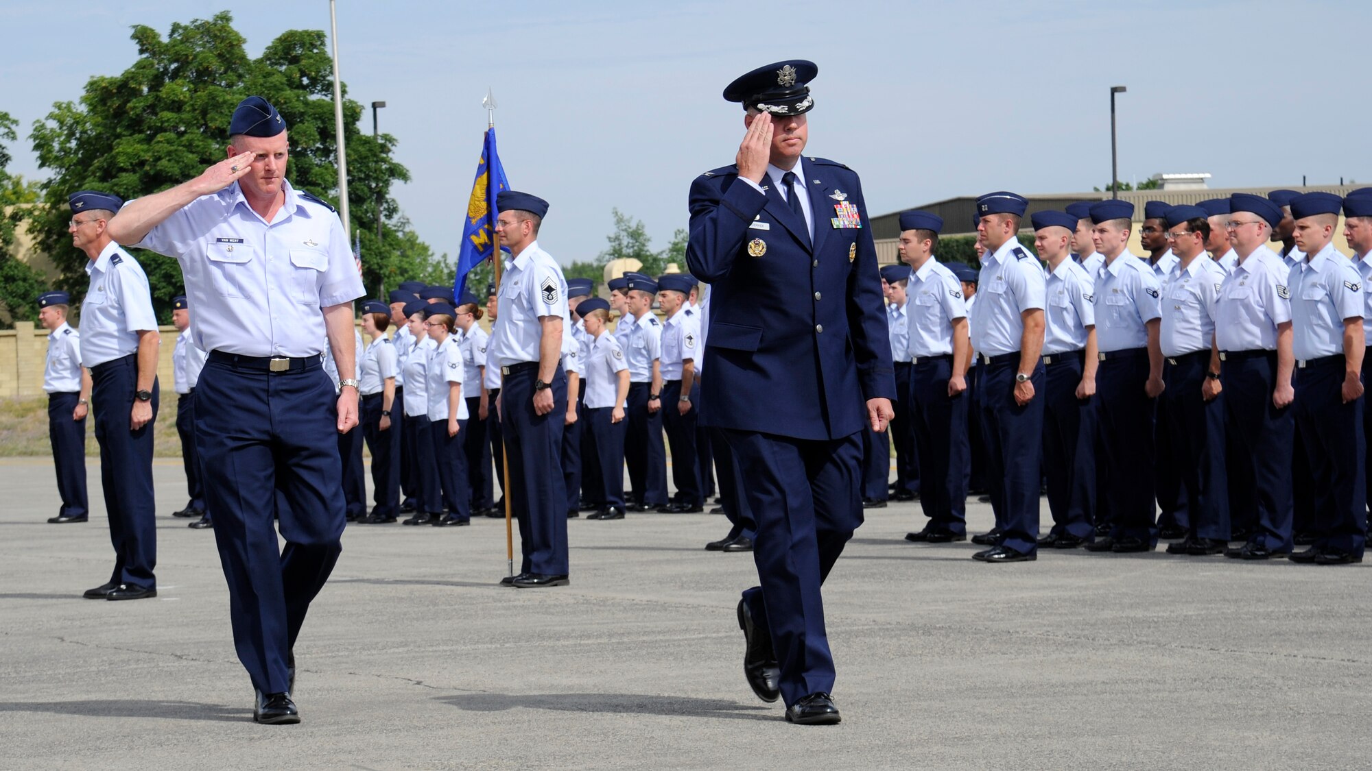 Col. Paul Guemmer, 92nd Air Refueling Wing commander, and Col. Marc Van Wert, 92nd Air Refueling Wing vice commander, reviews the troops at the change of command ceremony at Fairchild Air Force Base, Wash., Aug. 6, 2012. The change of command is a tradition that represents a formal transfer of authority and responsibility for a unit from one commander to the next. (U.S. Air Force photo by Airman 1st Class Ryan Zeski)