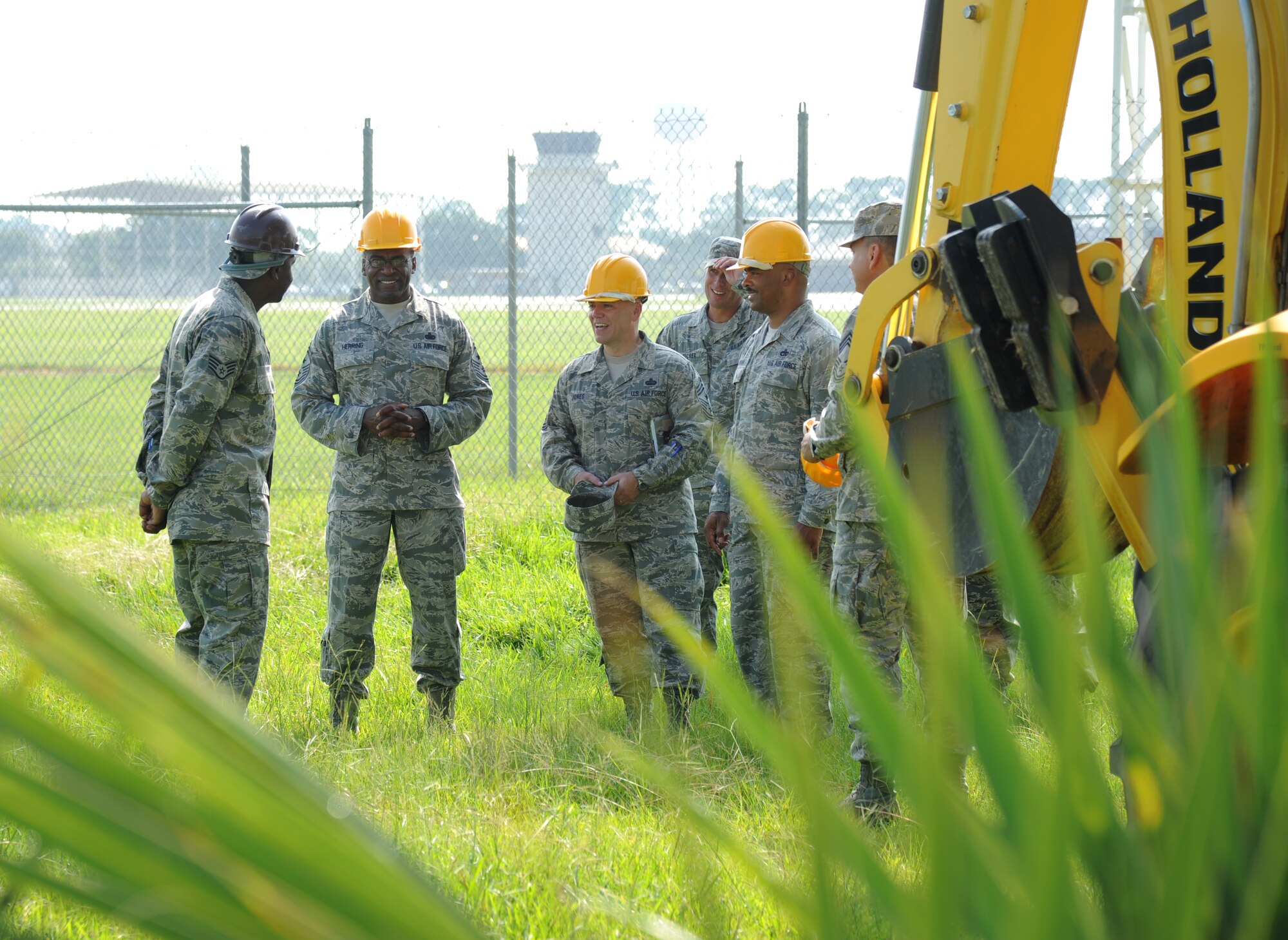 Staff Sgt. Joseph Perry, 85th Engineering Installation Squadron, left, briefs Chief Master Sgts. Alfred Herring, 24th Air Force command chief, Lackland Air Force Base, Texas;  William Jones, 688th Information Operations Wing command chief, Lackland AFB, Texas;  and Linus Jordan, Air Force Space Command command chief, Peterson Air Force Base, Colo., on the progress of a communications project August 9, 2012, at Keesler Air Force Base, Miss.  The chiefs visited the 85th EIS for a one-day visit of its facilities and current projects and conducted enlisted calls.  (U.S. Air Force photo by Kemberly Groue)