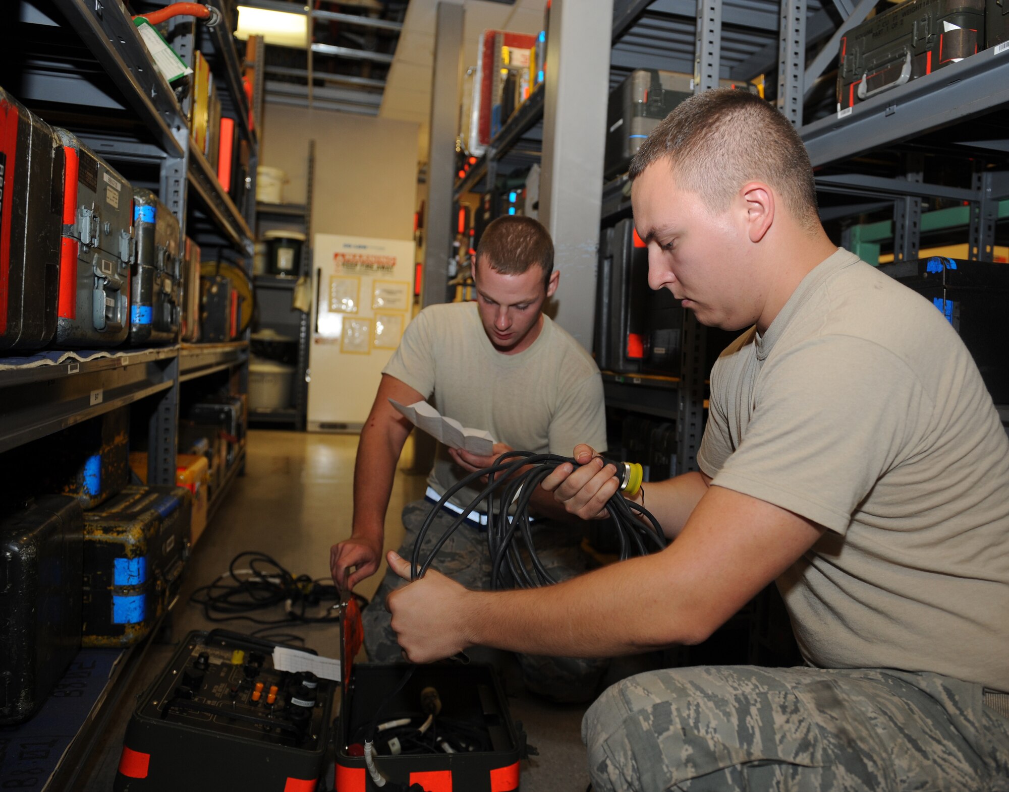 Senior Airmen Luke Jordan and Darren Dalton, 2nd Aircraft Maintenance Squadron support section, conduct an inspection on an interconnecting box on Barksdale Air Force Base, La., Aug. 8. After the inspection, it was determined there were zero defects on the piece of equipment. The 2 AMXS support section is responsible for more than 21,000 tools valued at $15 million. (U.S. Air Force photo/Airman 1st Class Benjamin Gonsier)(RELEASED)