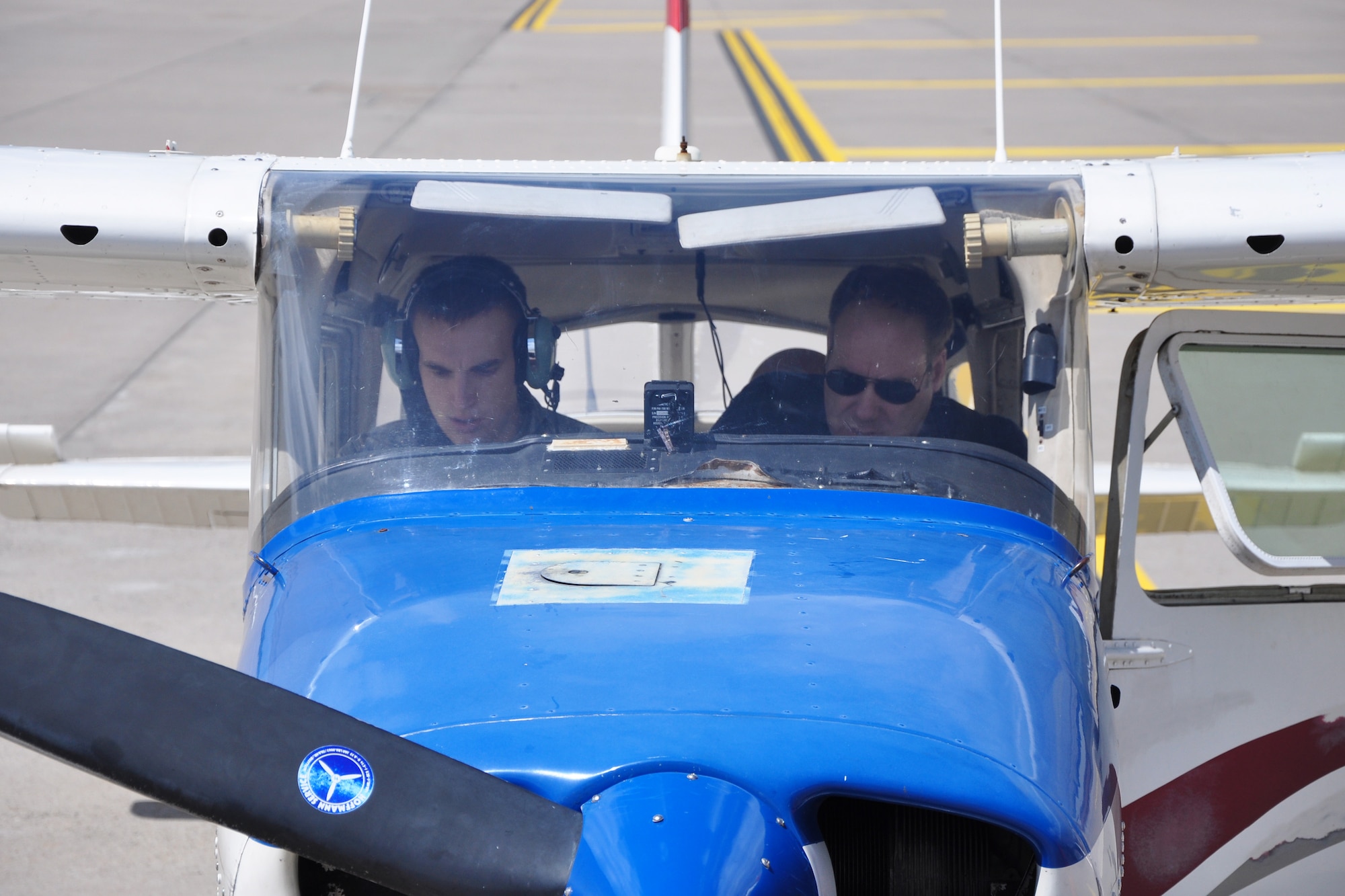 Airman 1st Class Nicholas Fennen and Lt. Col. Rich Radvanyi run through preflight checklists of a Cessna 172 during an incentive flight at Ramstein Air Base, Germany, June 22, 2012. Fennen was selected to participate in the Ramstein Daedalians Aviation Incentive Flight program, which provides quarterly aviation incentive flights to deserving young Airmen and gives them the chance to live a childhood fantasy of flight. Fennen is a 86th Airlift Wing Judge Advocate discharge paralegal and Radvanyi is a pilot and president of the Coleman Aero Club. (U.S. Air Force photo/Tech. Sgt. Chad Thompson) 

