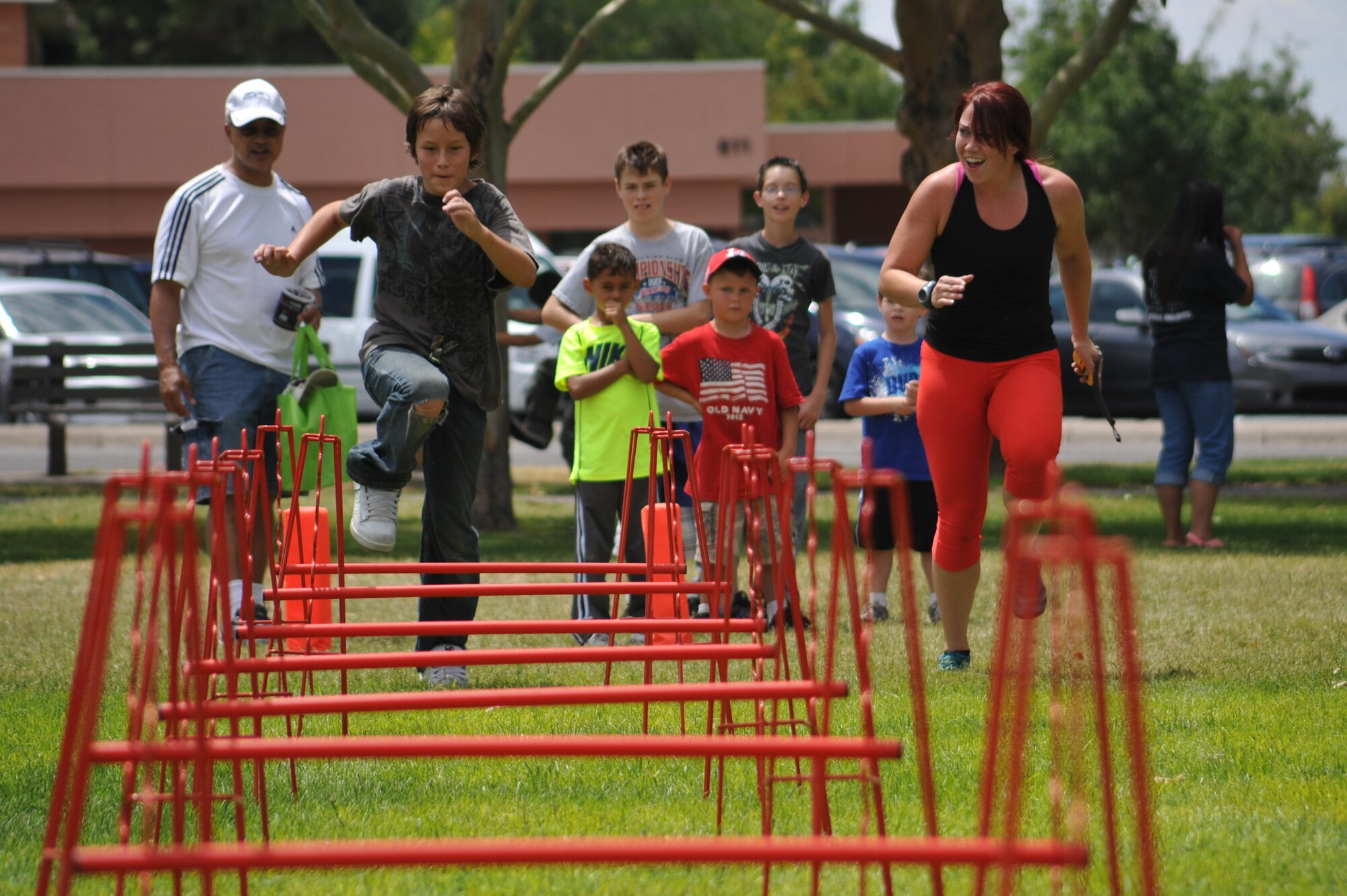 KIRTLAND AFB, N.M. – Thousands of people from Team Kirtland gathered Aug. 3 for Summer Bash at Hardin Field. The base fitness centers had a variety of activities during Summer Bash, including a quarterback challenge and a water balloon dodgeball event. (Photo by Ken Moore)