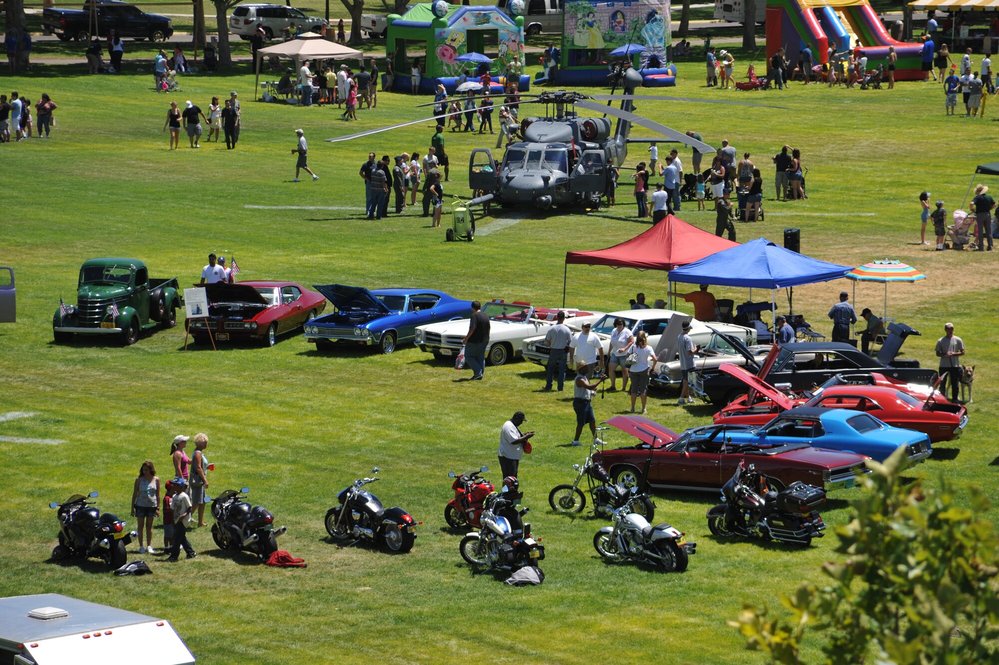 KIRTLAND AFB, N.M. – Thousands of people from Team Kirtland gathered Aug. 3 for Summer Bash at Hardin Field. The “Show of Force Power” vehicle display — which has become a regular fixture at Summer Bash for more than five years — featured a variety of vehicles. Bash-goers were able see more than a dozen classic cars and custom motorcycles. (Photo by Ken Moore)