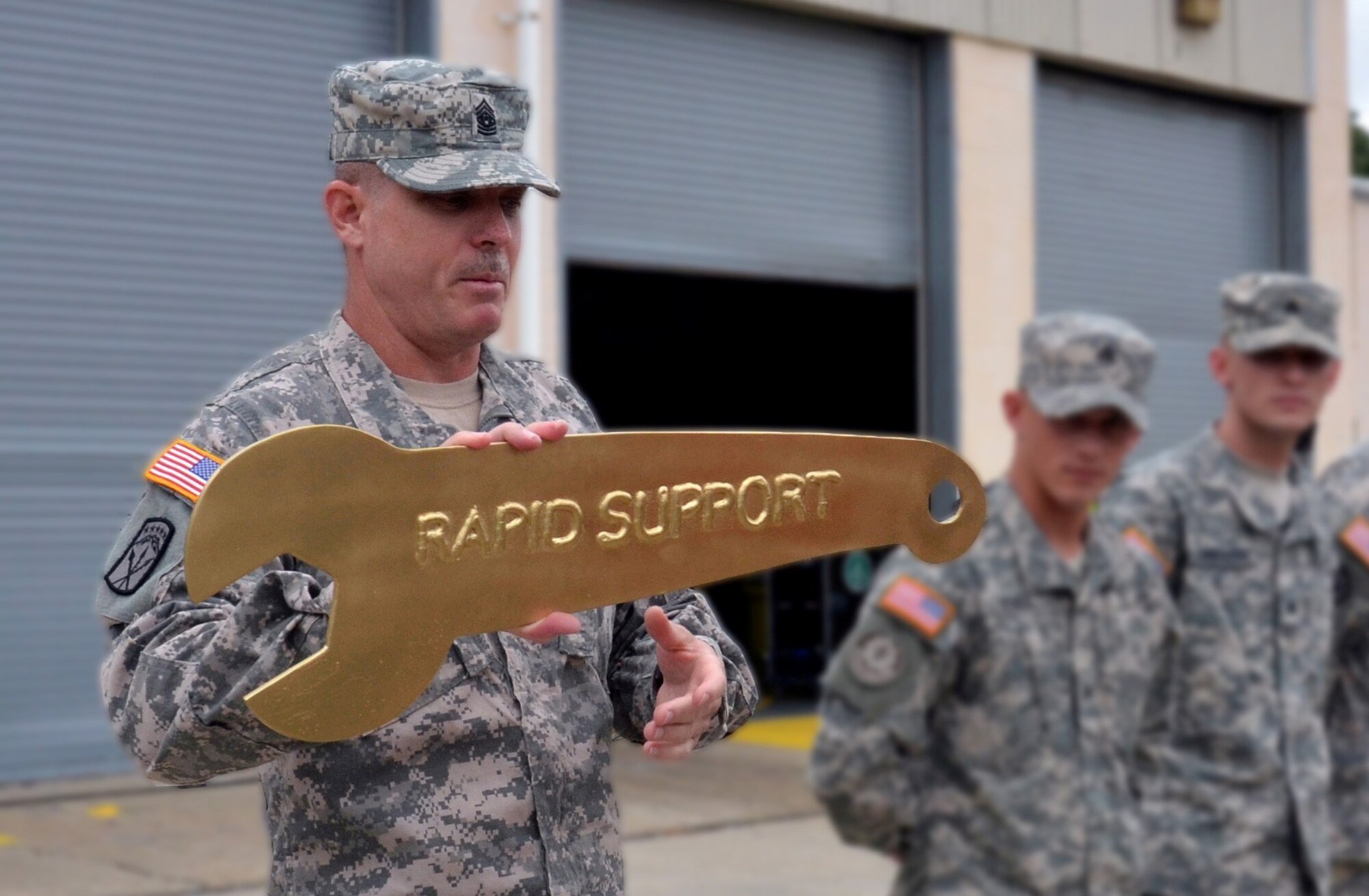 Command Sgt. Maj. Kenneth G. Blasko, 597th Transportation Brigade command sergeant major, addresses Soldiers from the 688th Rapid Port Opening Element before awarding them the "Golden Wrench" for their performance as the brigade's best maintenance program for third quarter 2012 at Fort Eustis, Va., Aug. 6, 2012. Each RPOE program is rated on vehicle inspections, operator knowledge, cleanliness of motorpool bays and tools, parts on-hand and records' management. This award is in conjunction with the best maintenance streamer, which the unit received, June 2012. (U.S. Army photo by Michelle Montieth/Released)