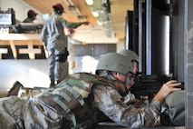MINOT AIR FORCE BASE, N.D. -- Airman 1st Class Ryan Grisso, 5th Maintenance Squadron, fires his weapon downrange during combat arms training and maintenance here, Aug. 2.  The basic marksman skill training includes intensive weapons training and incorporates target acquisition, threat discrimination, multiple-threat engagement and surviving weapon malfunction and stoppages. (U.S. Air Force photo/Senior Airman Brittany Y. Auld)