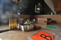 MINOT AIR FORCE BASE, N.D. – Airmen participating in combat arms training and maintenance, load their weapons with ammunition here, Aug. 2.  Combat arms training and maintenance instructors are security forces personnel who train military members on weapon use. (U.S. Air Force photo/Senior Airman Brittany Y. Auld)