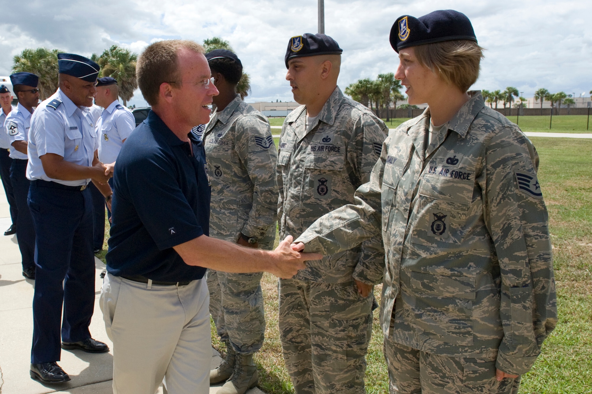 Staff Sgt. Kristin Daly, 45th Security Forces Squadron, is greeted Monday by Mr. Jeffrey Allen, the Director of Logistics, Installations and Mission Support for Air Force
Space Command. Directly behind Mr. Allen is Brig. Gen. Anthony Cotton, commander, 45th Space Wing. Mr. Allen was here to tour the Wing and to take part in a ribbon-cutting ceremony for the new Combat Arms Training Facility. (Photo by Julie Dayringer)