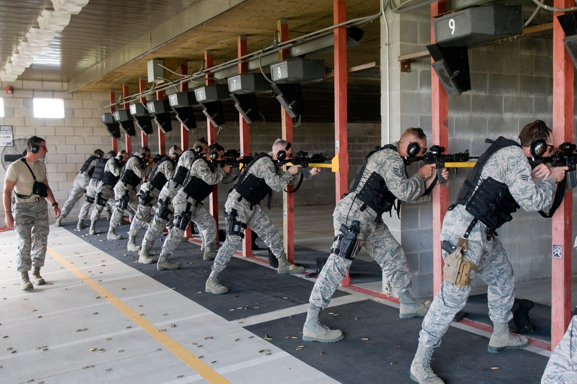 GRISSOM AIR RESERVE BASE, Ind. -- Staff Sgt. Alasdair Earley, 434th Security Forces Squadron combat arms specialist, monitors other 434th SFS Airmen as they fire their M-4 carbine rifles during a recent weapons training event held here. Earley and other SFS Airmen participated in the training that is meant to keep them ready to deploy around the world at a moment's notice. (U.S. Air Force Photo/Jami K. Lancette)
