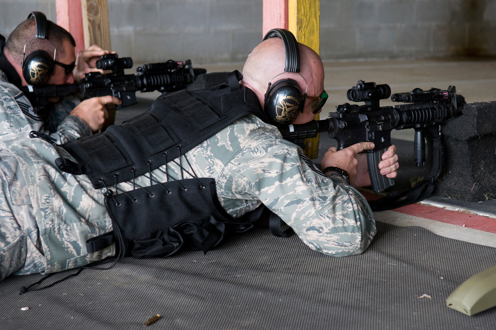 GRISSOM AIR RESERVE BASE, Ind. -- 434th Security Forces Squadron Airmen sight in their M-4 carbine rifles and prepare to fire during a recent weapons training event held here. The Airman shot through the day and qualified at night using night vision equipment. (U.S. Air Force Photo/Jami K. Lancette)
