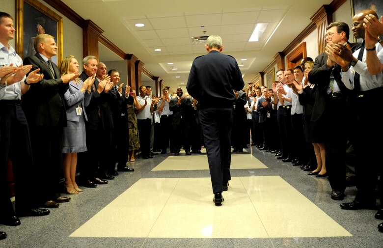 Gen. Norton Schwartz was surprised with applause from hundreds of Airmen lining the Pentagon hallway, Aug. 8, 2012, as he departed the building for the final time as the AirForce Chief of Staff. Schwartz will retire in a ceremony Friday, after serving 39 years in the Air Force, the last four years as the Air Force's senior uniformed leader. (U.S. Air Force photo by
Master Sgt. Cecilio Ricardo)
