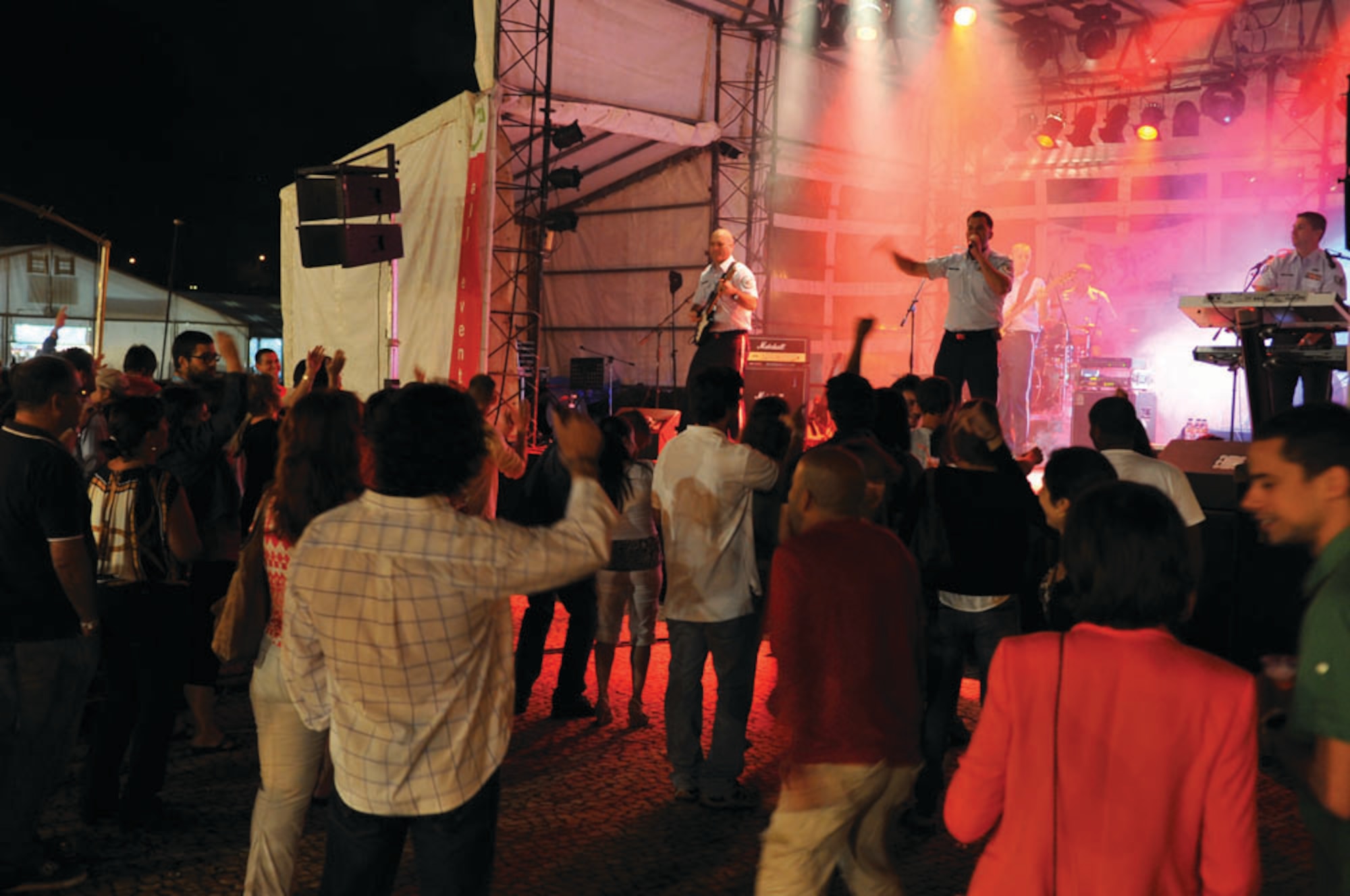 USAFE Band Touch 'n Go performs a concert during Praia Fest Aug. 7.  Despite the rainy forecast, they continued to entertain the local Portuguese community.  (U.S. Air Force photo by Tech. Sgt. Chenzira Mallory)