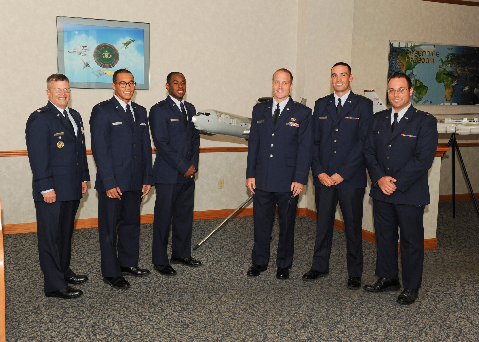 Lt. Col. Charles Thompson, 611th Air Operations Command deputy commander and graduation speaker, and Team Tyndall's five Air Battle Manager graduates pose for a photo Aug. 8 as part of the ABM graduation ceremony at the 325th Air Control Squadron. (U.S. Air Force photo by Chris Cokeing)