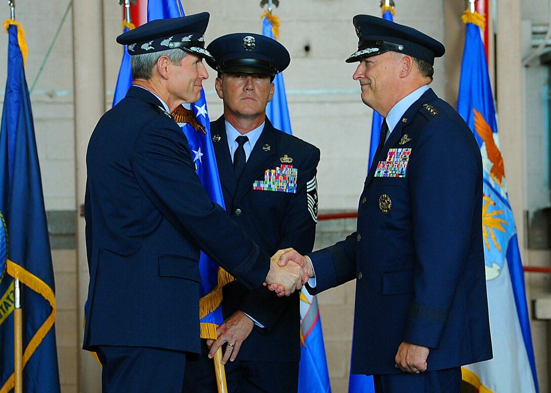 Air Force Chief of Staff Gen. Norton Schwartz congratulates Gen. Gary North, former Pacific Air Forces commander, during the PACAF change of command ceremony at Joint Base Pearl Harbor-Hickam, Hawaii, Aug. 3, 2012. Gen. Herbert Carlisle is the successor to North, who is set to retire Oct. 1. (U.S. Air Force photo/Tech. Sgt. Jerome S. Tayborn)